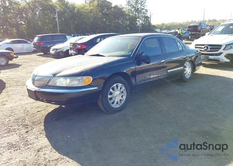 1999 Lincoln Continental z USA, uszkodzony, nr VIN 1LNHM97V7XY609915